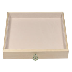 Third jewelry box drawer is simply open to serve as a catch all for other large jewelry items