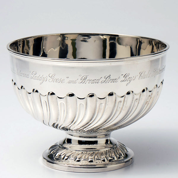 Sterling trophy bowl on a pedestal base.