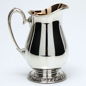 Cream Pitcher with gold lining. 5" high.